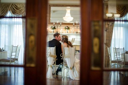 bride and groom kissing loose mansion kc